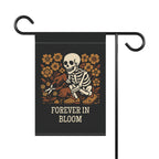 Garden flag with skeleton and flowers design and 'Forever in Bloom' text on a black background.