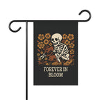 Garden flag with skeleton and flowers design on a black background