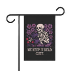 Garden flag with skeleton and flowers design on a black background