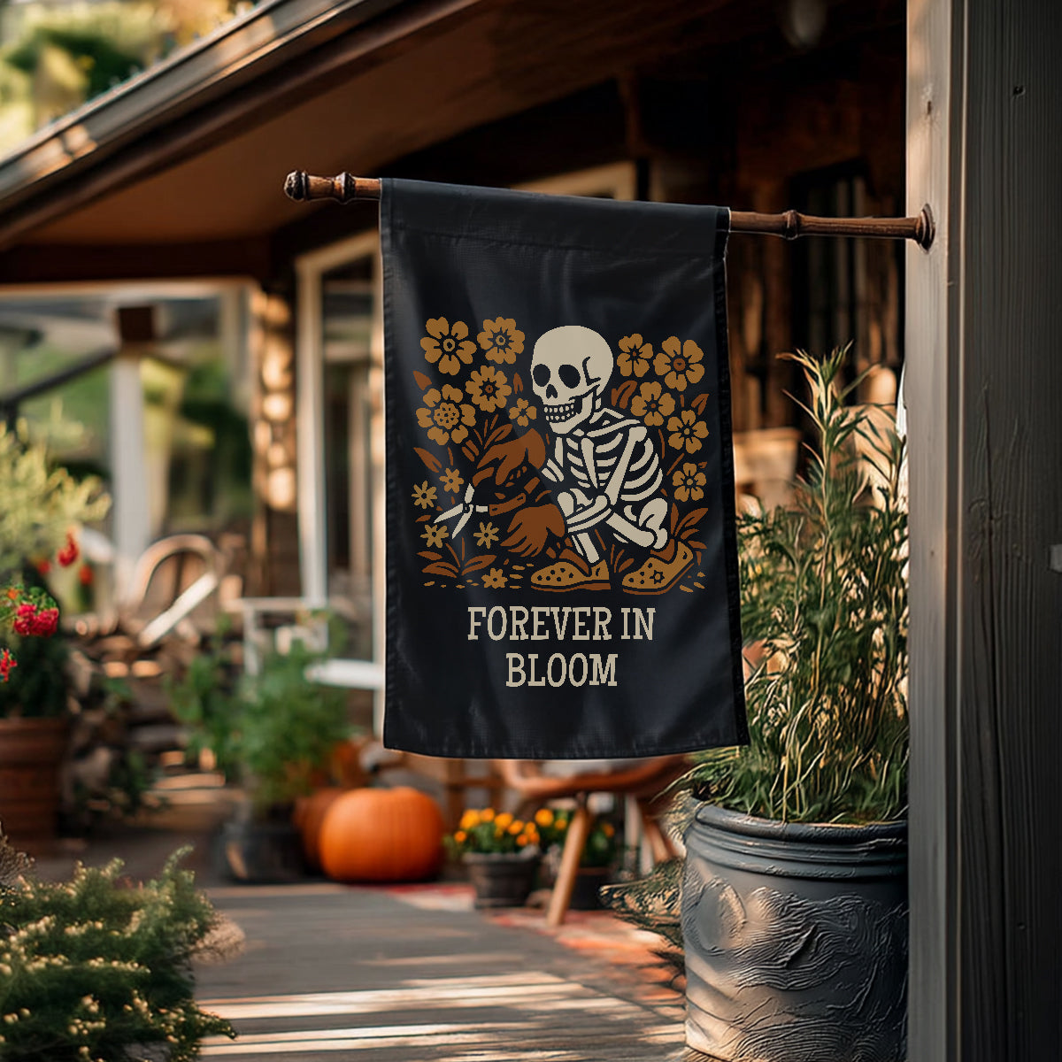 Decorative flag with skeleton and flowers design hanging outside a house.