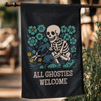 Decorative garden flag with a skeleton and floral design, featuring the text 'All Ghosties Welcome', hanging outdoors.