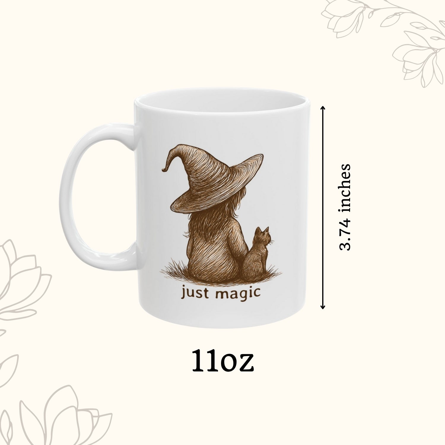White mug with a design of a bear wearing a witch hat and text 'just magic' on a white background.