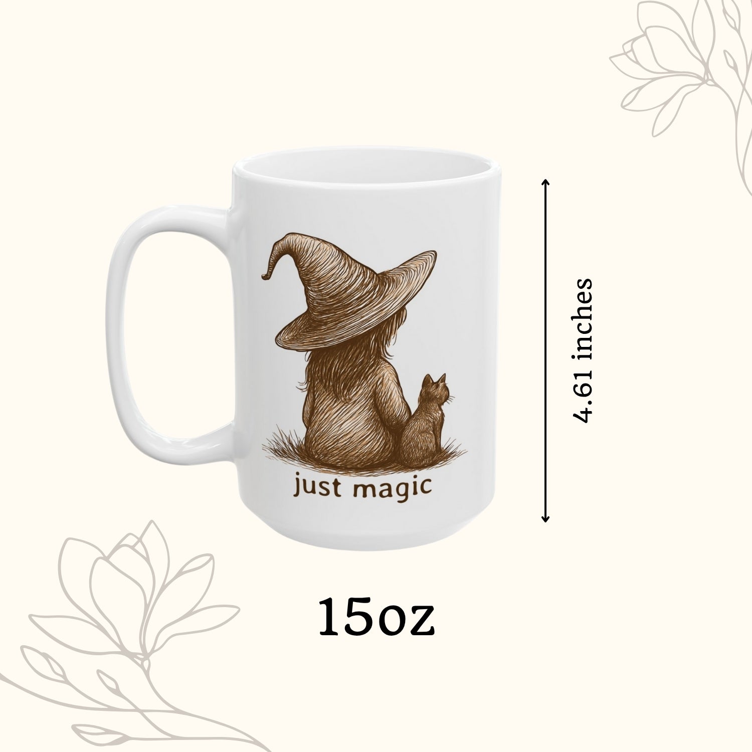 White mug with a brown illustration of a person in a witch hat and a cat, with 'just magic' text, on a white background.